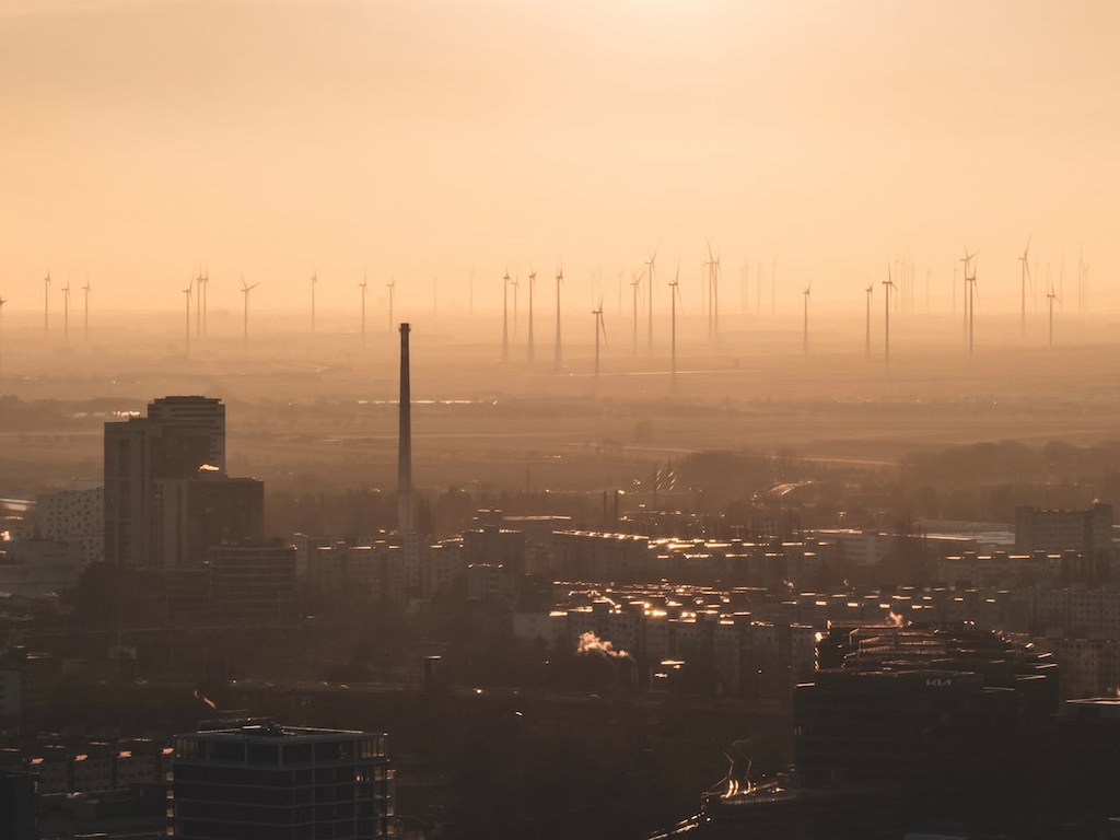 sunset skyline with wind turbines