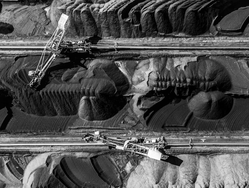 birds-eye-view-of-heavy-equipment-at-a-mining-site birds eye view of heavy equipment at a mining site
