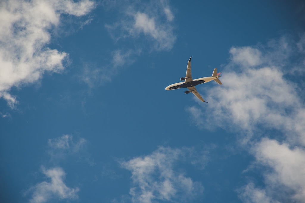 worms-eye-view-of-airplane-flying-on-sky worms eye view of airplane flying on sky