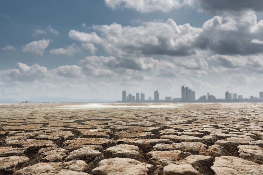 dry-ground-with-megalopolis-on-background dry ground with megalopolis on background