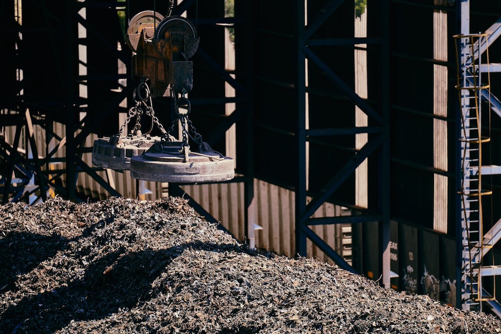 industrial scrap metal yard with magnet crane