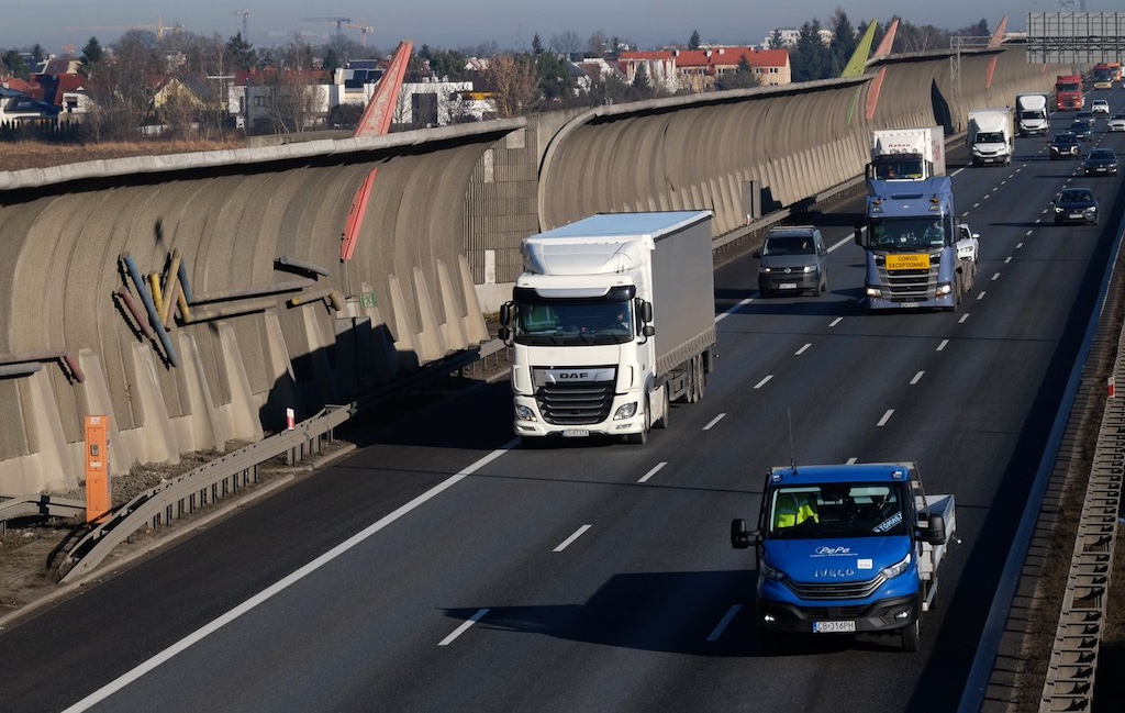 busy highway traffic with trucks and cars