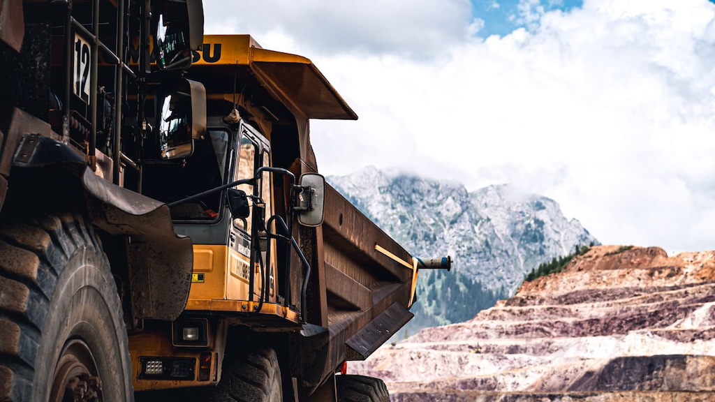 massive-mining-truck-in-mountainous-landscape massive mining truck in mountainous landscape