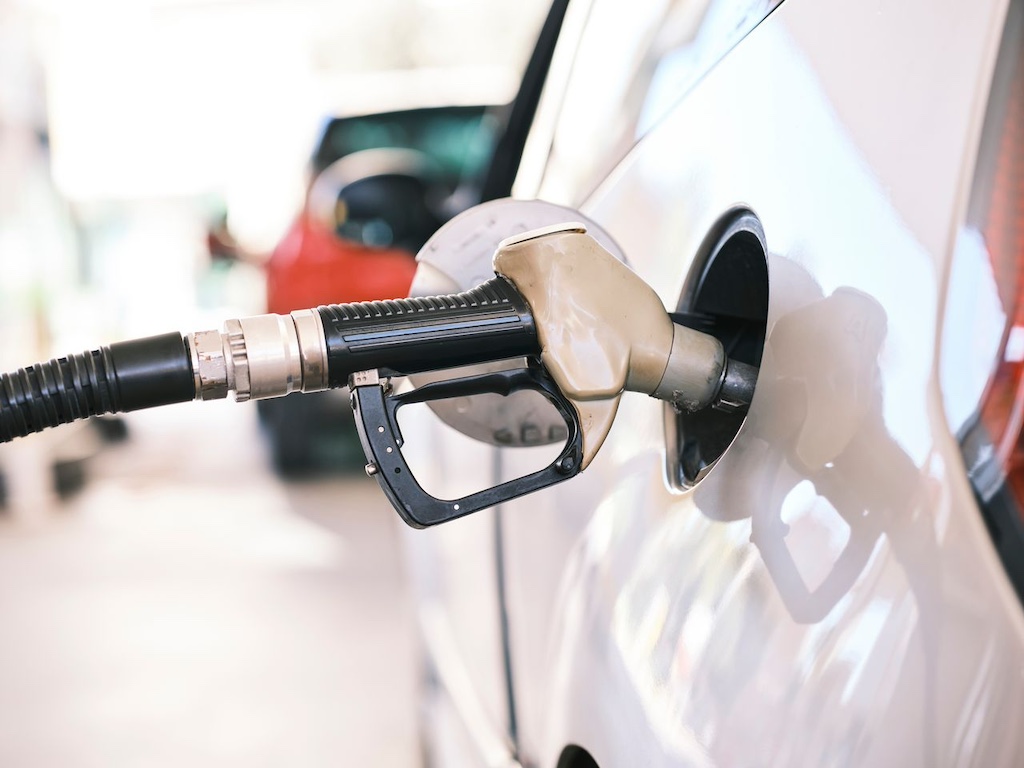 white gasoline pump in gas station